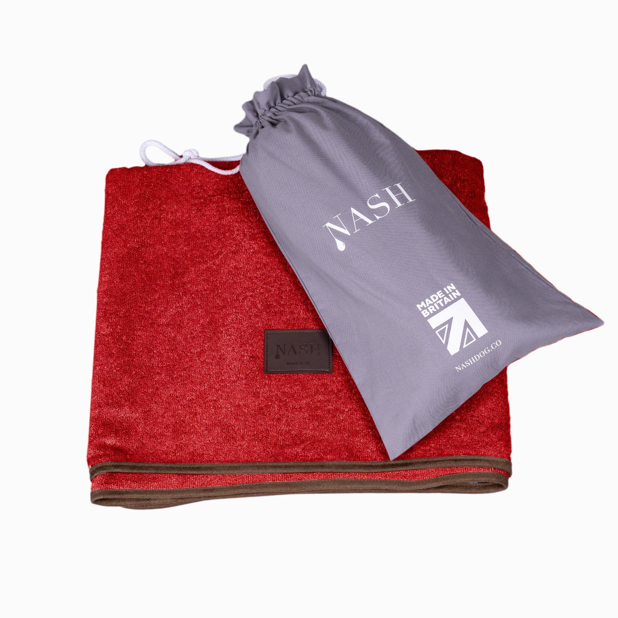 Folded NASH bamboo dog blanket in red, with its reusable bag placed on top.
