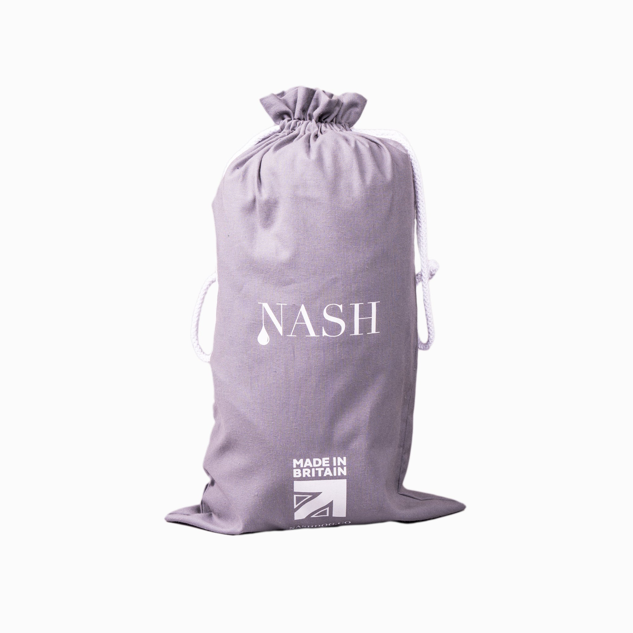 A NASH bamboo dog bed cover in its reusable drawstring bag. 